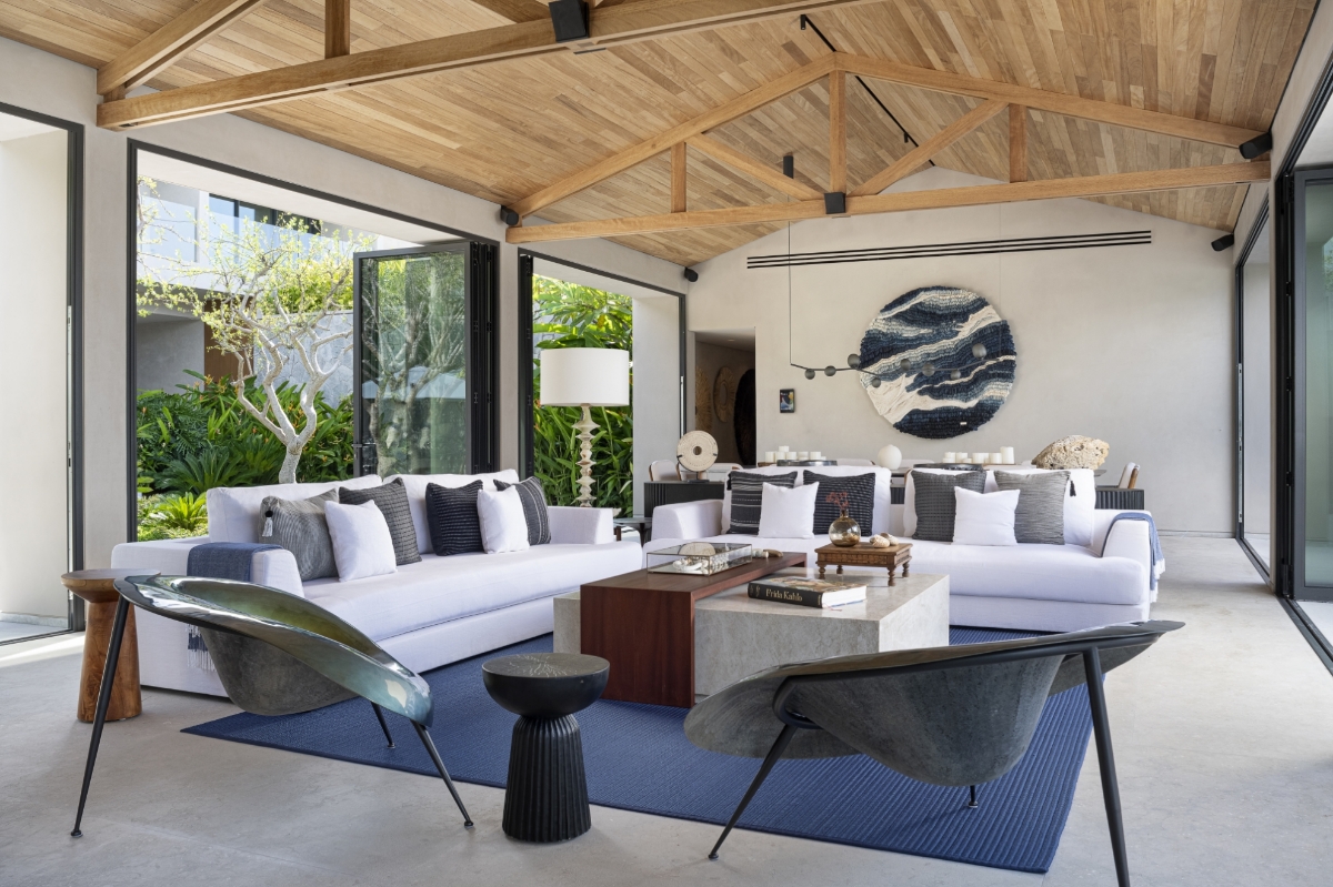 Contemporary lounge and entertainment space at Bella Vils featuring modern decor and elegant architectural details
