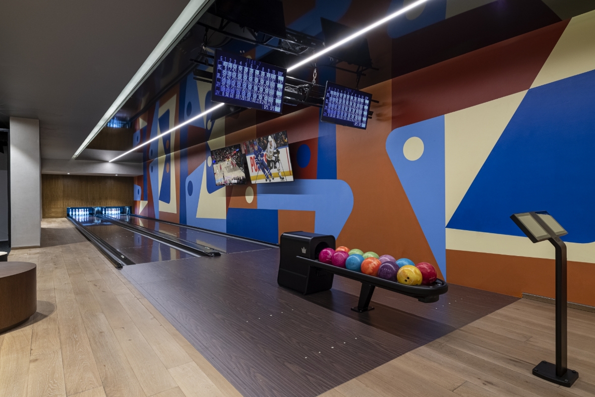 Private bowling alley at Bella Vils with colorful modern design and luxury entertainment amenities