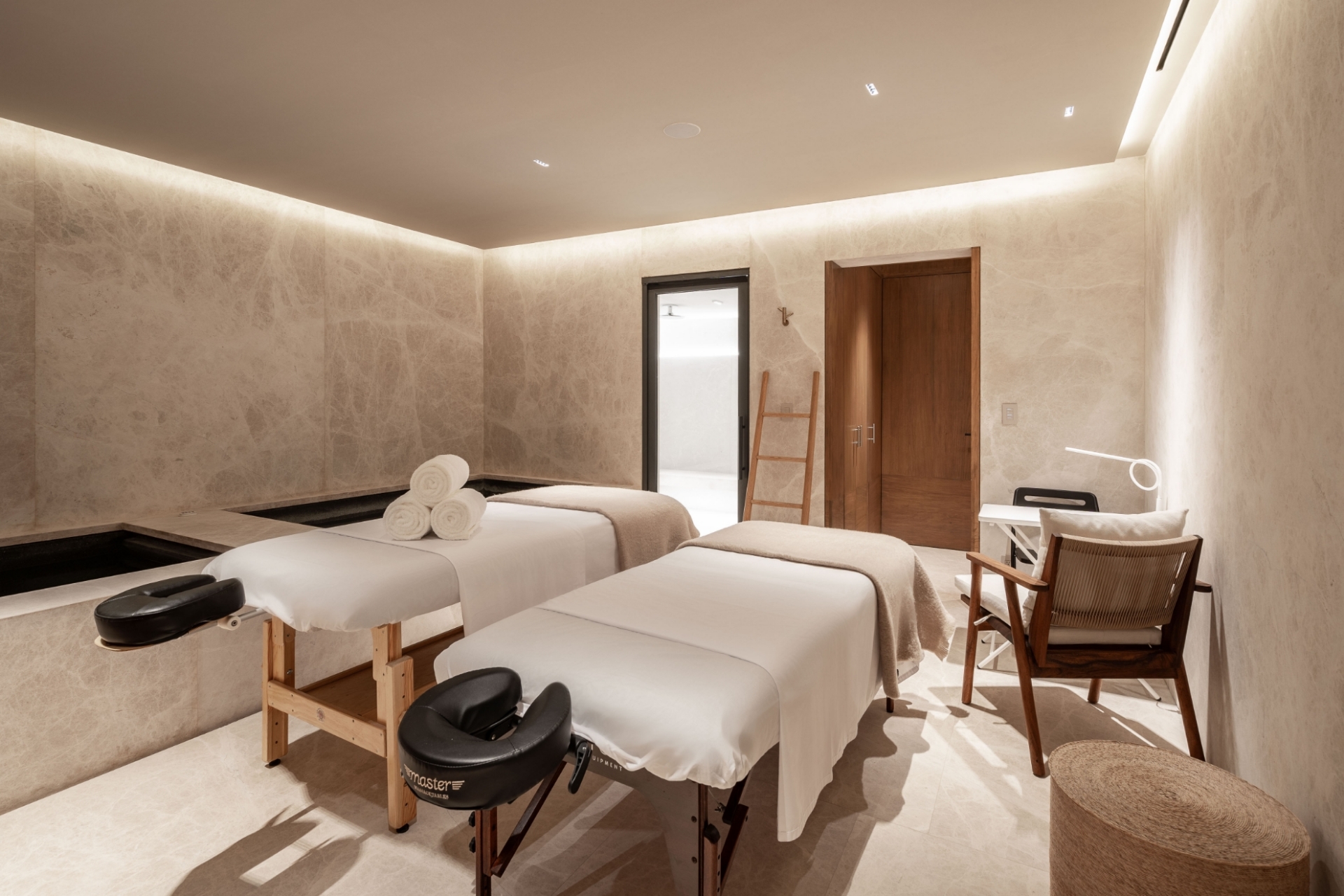 Luxury home spa and massage room at Bella Vils with premium twin tables and elegant minimalist design