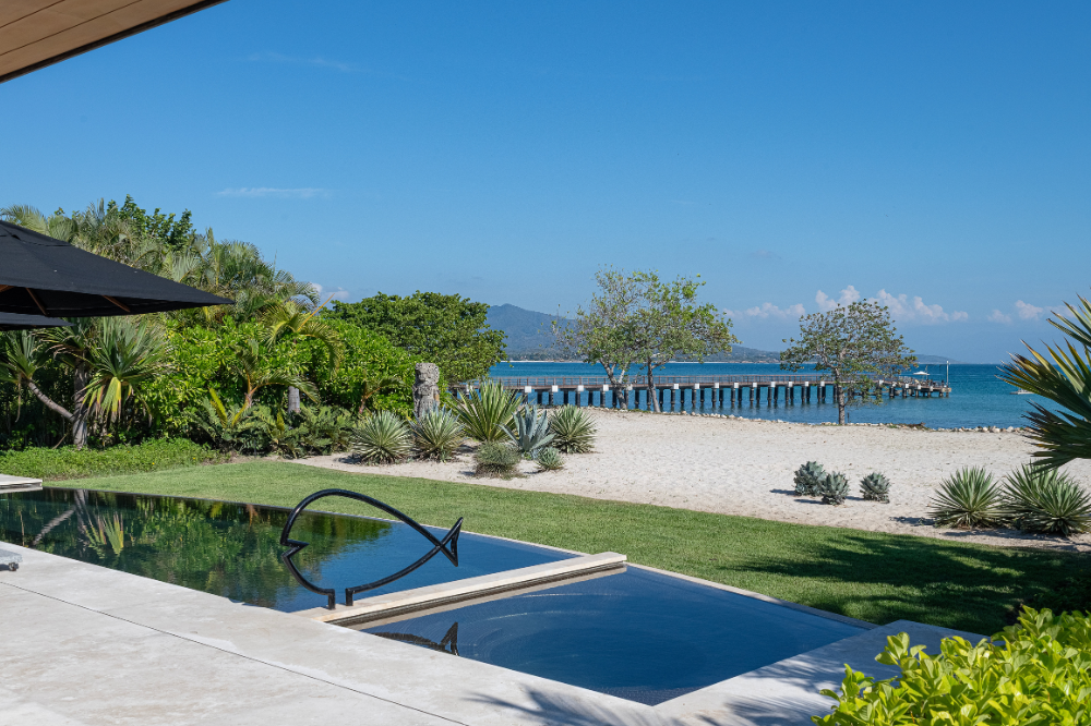 Mediterranean style villa Casa Clarita in Porta Fortuna Punta Mita with oceanfront terrace and dining area.
