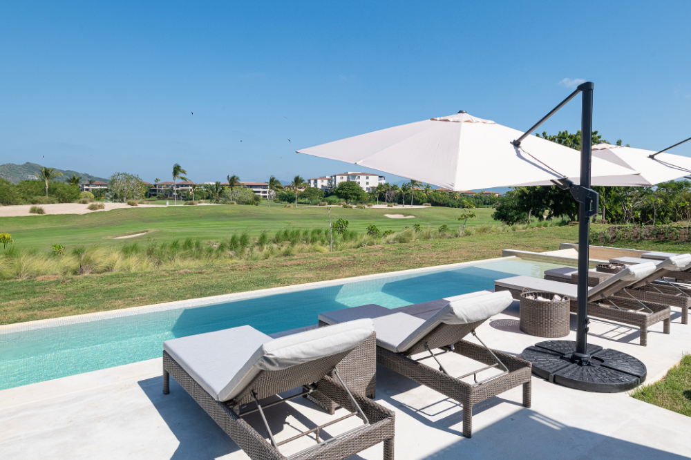 Architectural golf-side villa in Porta Fortuna with minimalist Mexican design and private courtyard pool.
