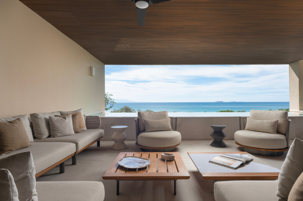 Modern four-bedroom oceanview surf residence in Punta Mita Mexico, showing coastal-cool interiors and Pacific sunset views at Condo Arena by VEHM.